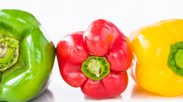 Close-up of green; red and yellow bell peppers