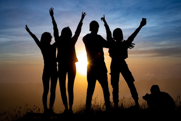 Close-up. a group of tourists meet the dawn on the volcano Batur. Bali Indonesia