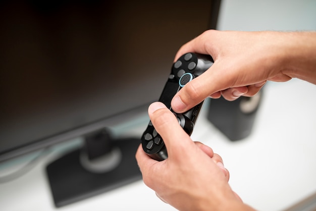 Close-up guy holding a controller