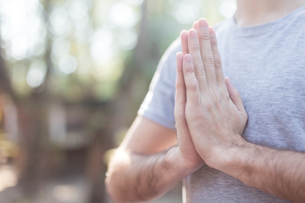 Close-up of guy with hands together