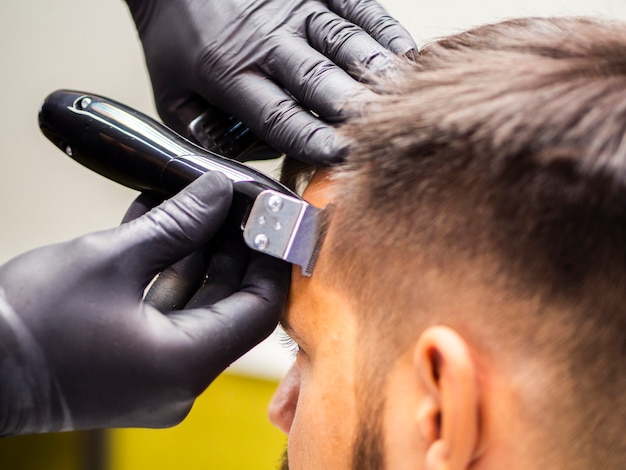 Close-up of hairdresser hands with gloves