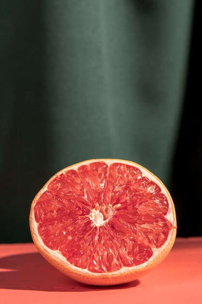 Close up halved grapefruit on table