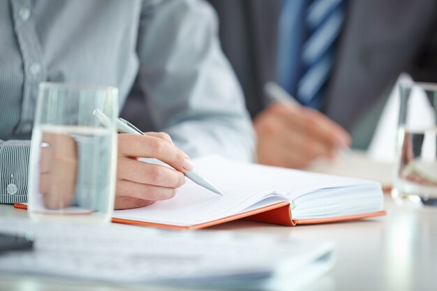 Close-up of the hand of a busy businesswoman