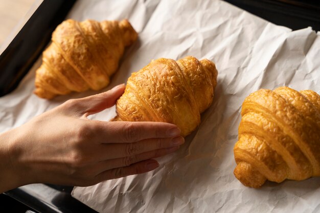 Close up hand and croissants