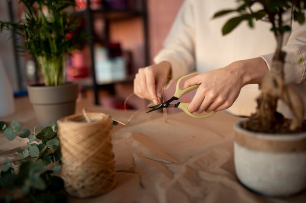 Close up hand cutting thread