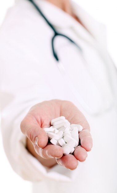 Close up of hand of a doctor with pills