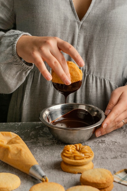 Close up hand holding alfajores