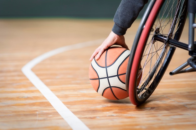 Close-up hand holding basketball