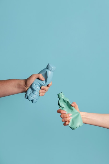 Close up hand holding bottle pet