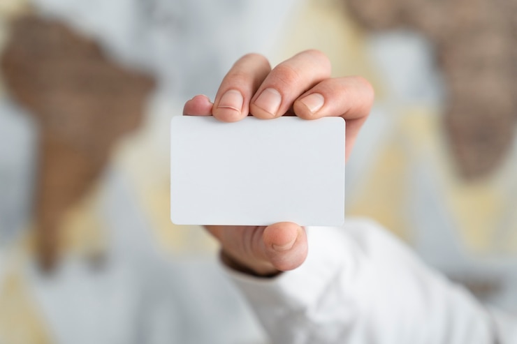 Free Photo close up hand holding business card