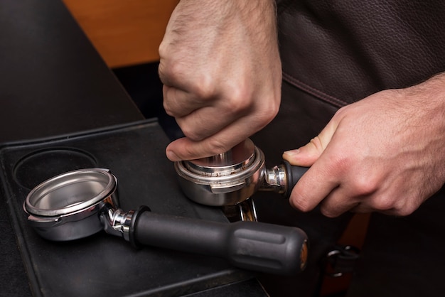 Free photo close-up hand holding coffee filter