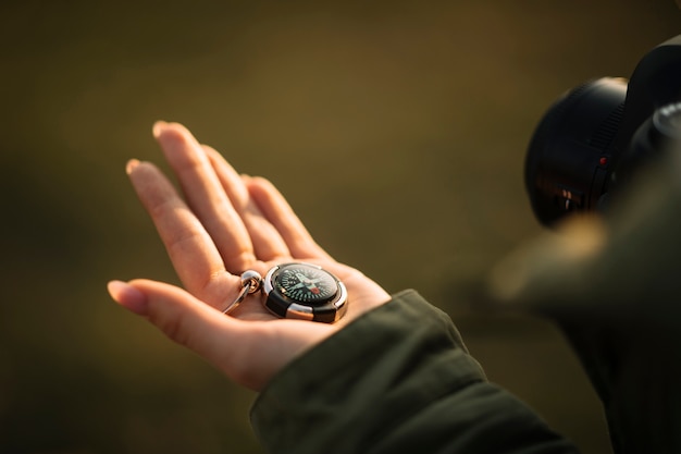 Close-up hand holding compass