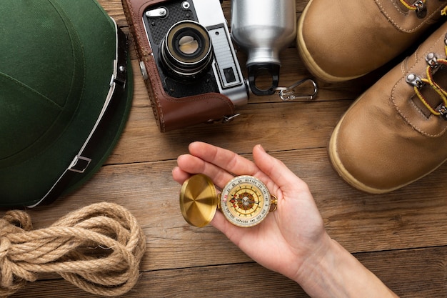 Free photo close-up hand holding compass