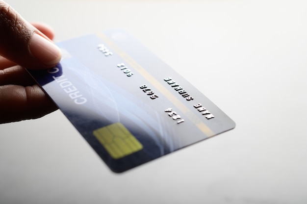 Free photo close up of hand holding credit card