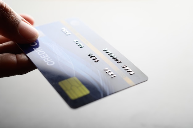 Close up of hand holding credit card