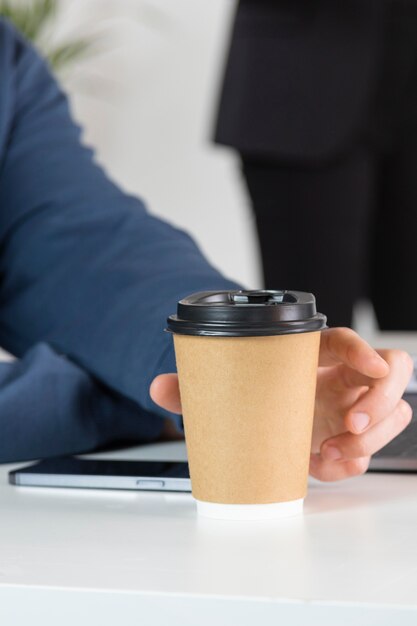 close-up hand holding cup
