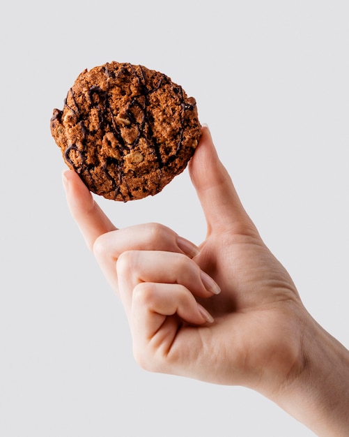 close up hand holding Delicious cookies