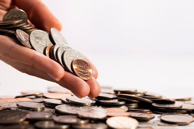 Close up on hand holding dollar coins
