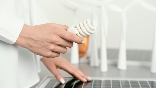 Close up hand holding eco lightbulb