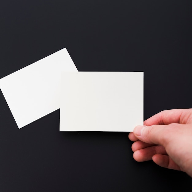 Close-up hand holding empty business card