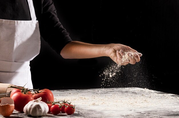 Close-up hand holding flour