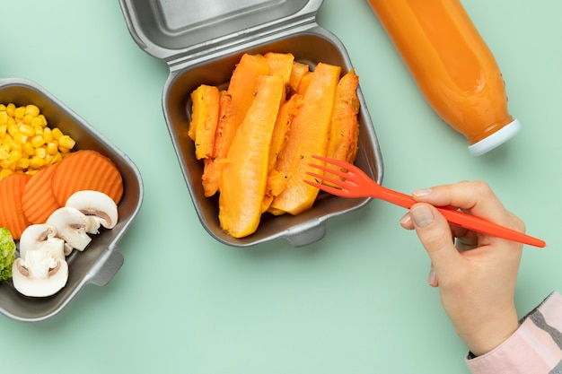 Close up hand holding fork