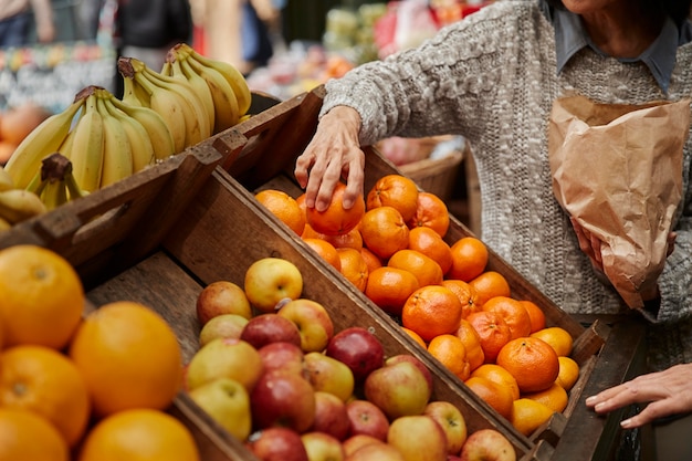 Close up hand holding fruit