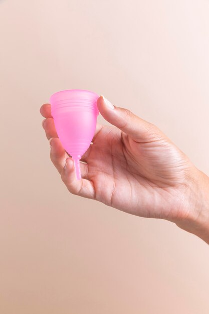 Close-up hand holding menstrual cup