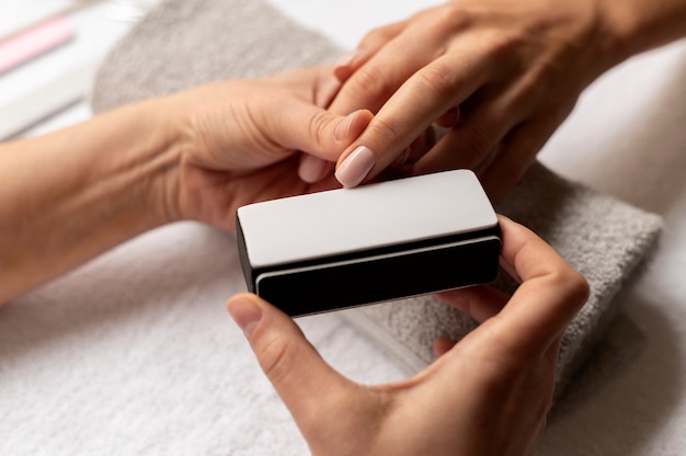 Close up hand holding nail file