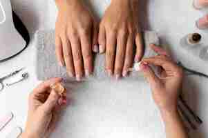 Free photo close up hand holding nail product