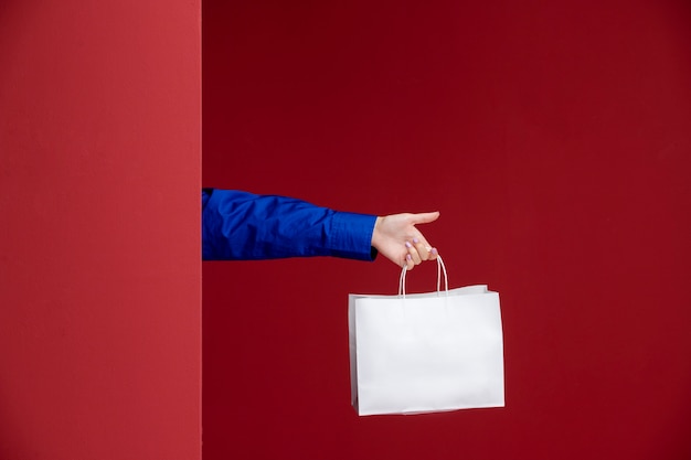 Close up hand holding paper bag