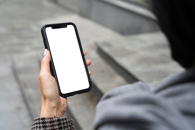 Close-up hand holding phone