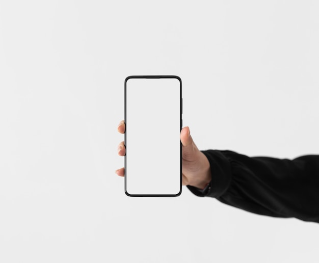 close up hand holding phone
