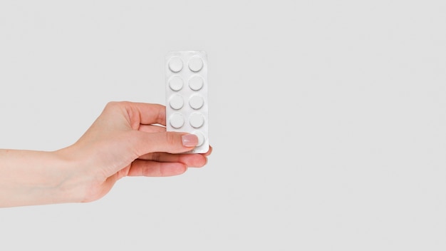 Close-up hand holding pills