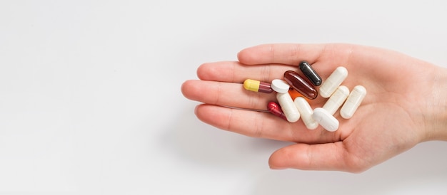 Close-up hand holding pills