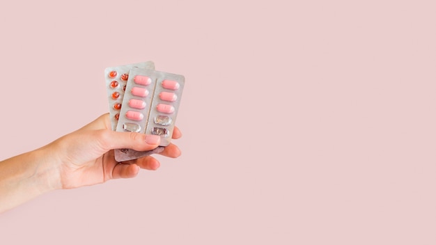 Close-up hand holding pills