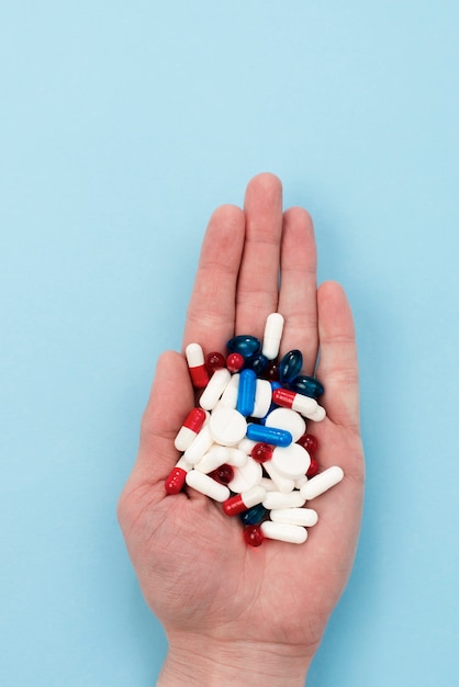 Close-up hand holding pills