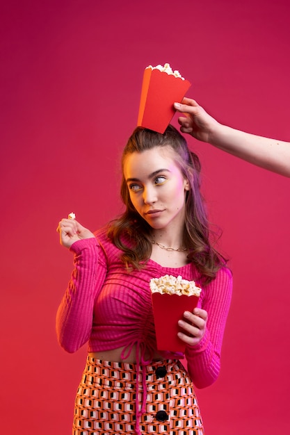 Close up hand holding popcorn bag