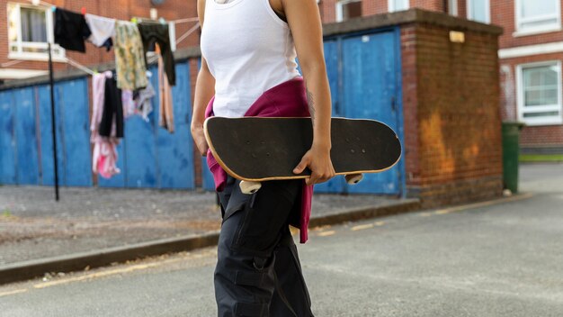 Close up hand holding skateboard