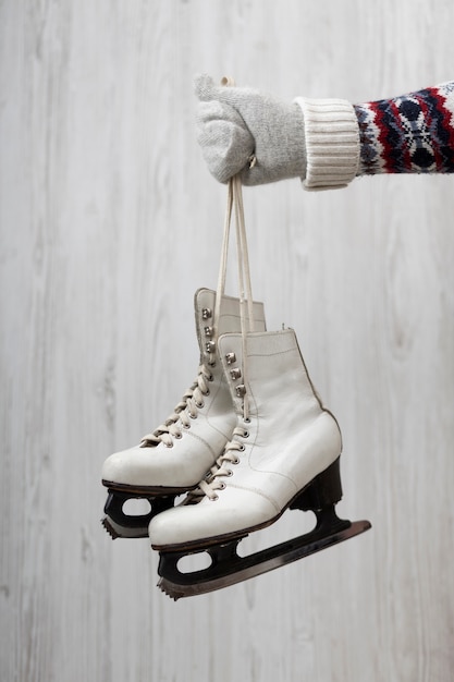 Close up hand holding skates