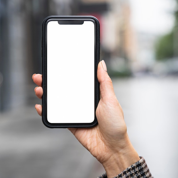 Close-up hand holding smartphone