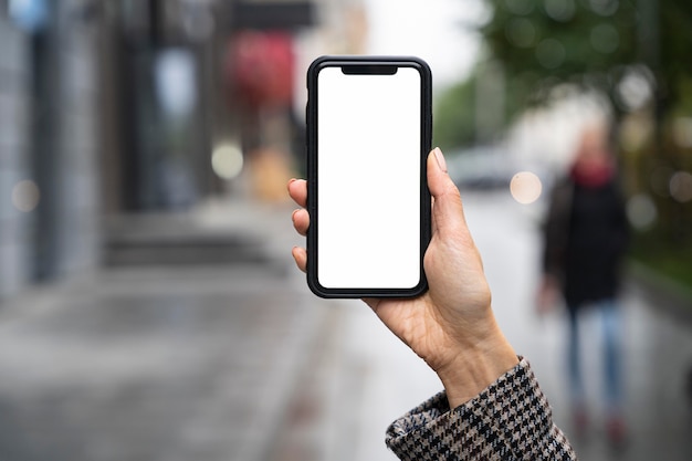 Close-up hand holding smartphone