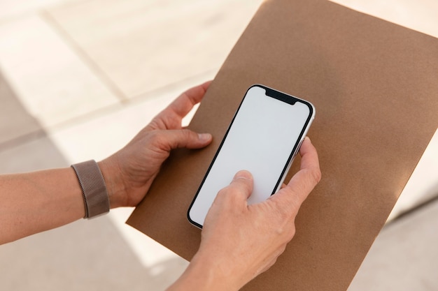 Close-up hand holding smartphone