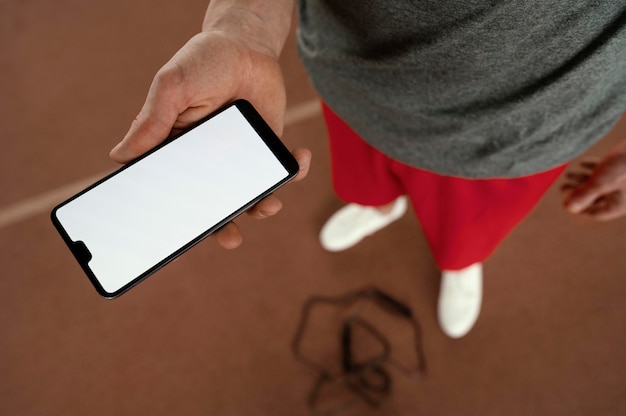 Close-up hand holding smartphone