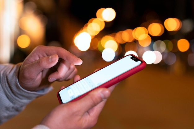 close up hand holding smartphone