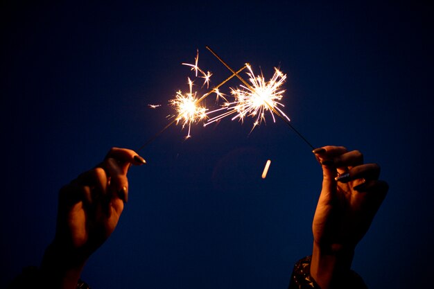 Close up hand holding sparks