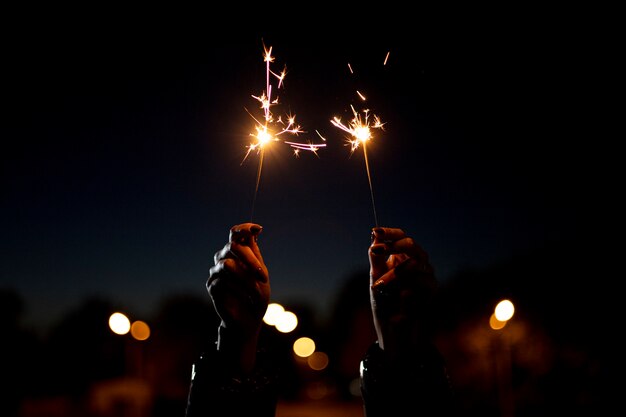 Close up hand holding sparks