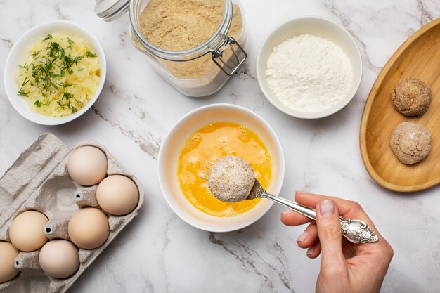 Close up hand holding spoon