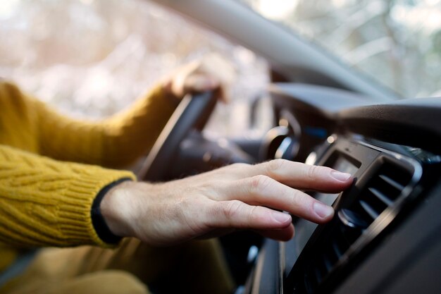 Close up hand holding steering wheel