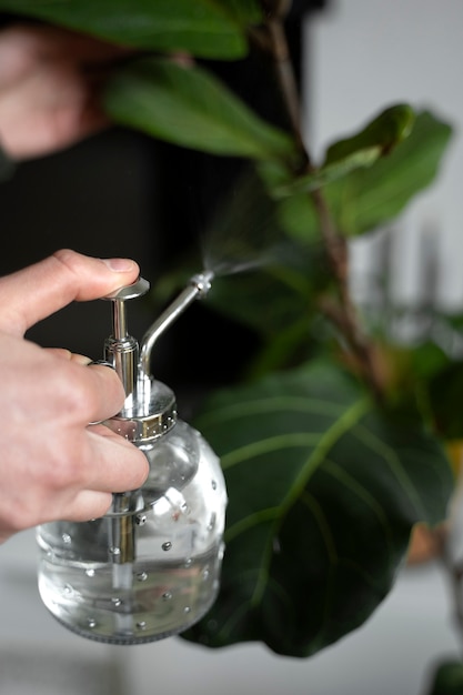 Close up hand holding water bottle